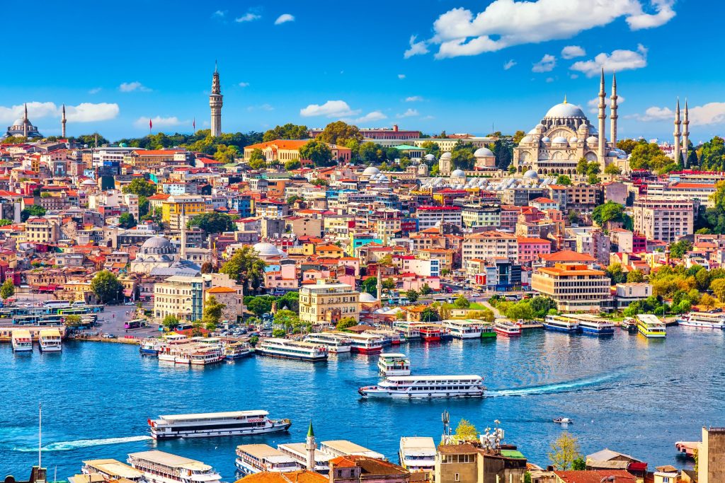touristic sightseeing ships golden horn bay istanbul mosque with sultanahmet district against blue sky clouds istanbul turkey during sunny summer day scaled 1