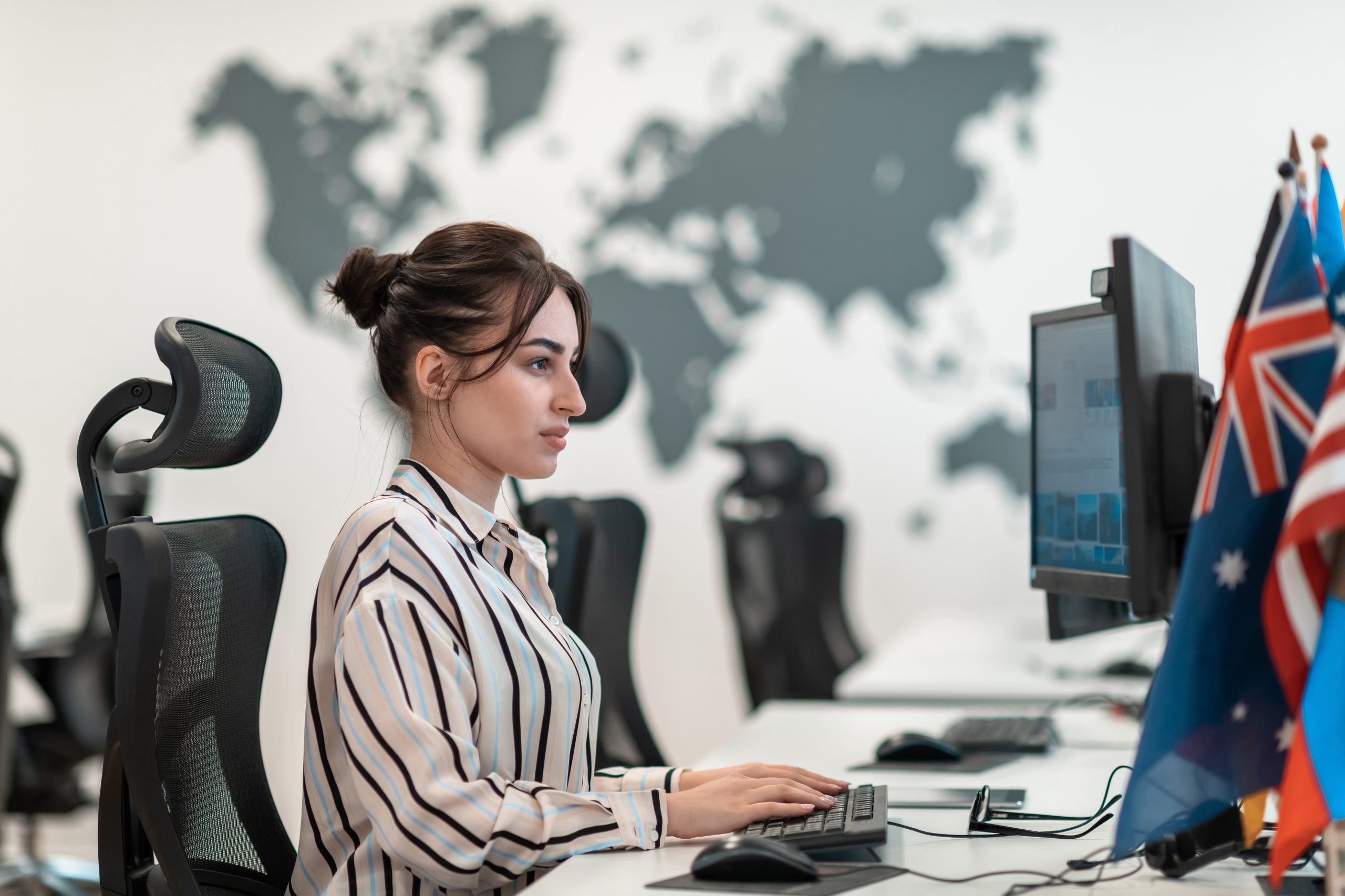 casual businesswoman working desktop computer modern open plan startup office interior selective focus high quality photo scaled